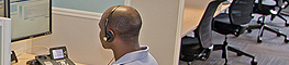 A man working at the service desk